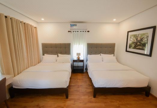 Casita room with two queen beds and elegant decor